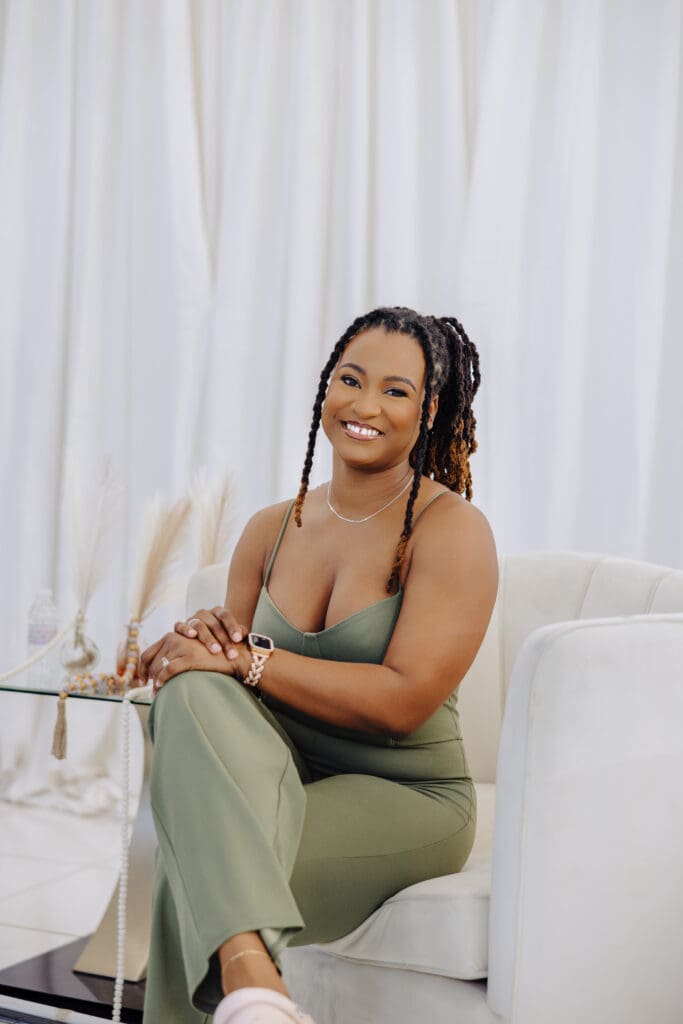 Physiotherapist Natalia Fennell smiling while seated, guest on the Menopause Rebirth Podcast Episode 2 discussing body tightness and menopause.
