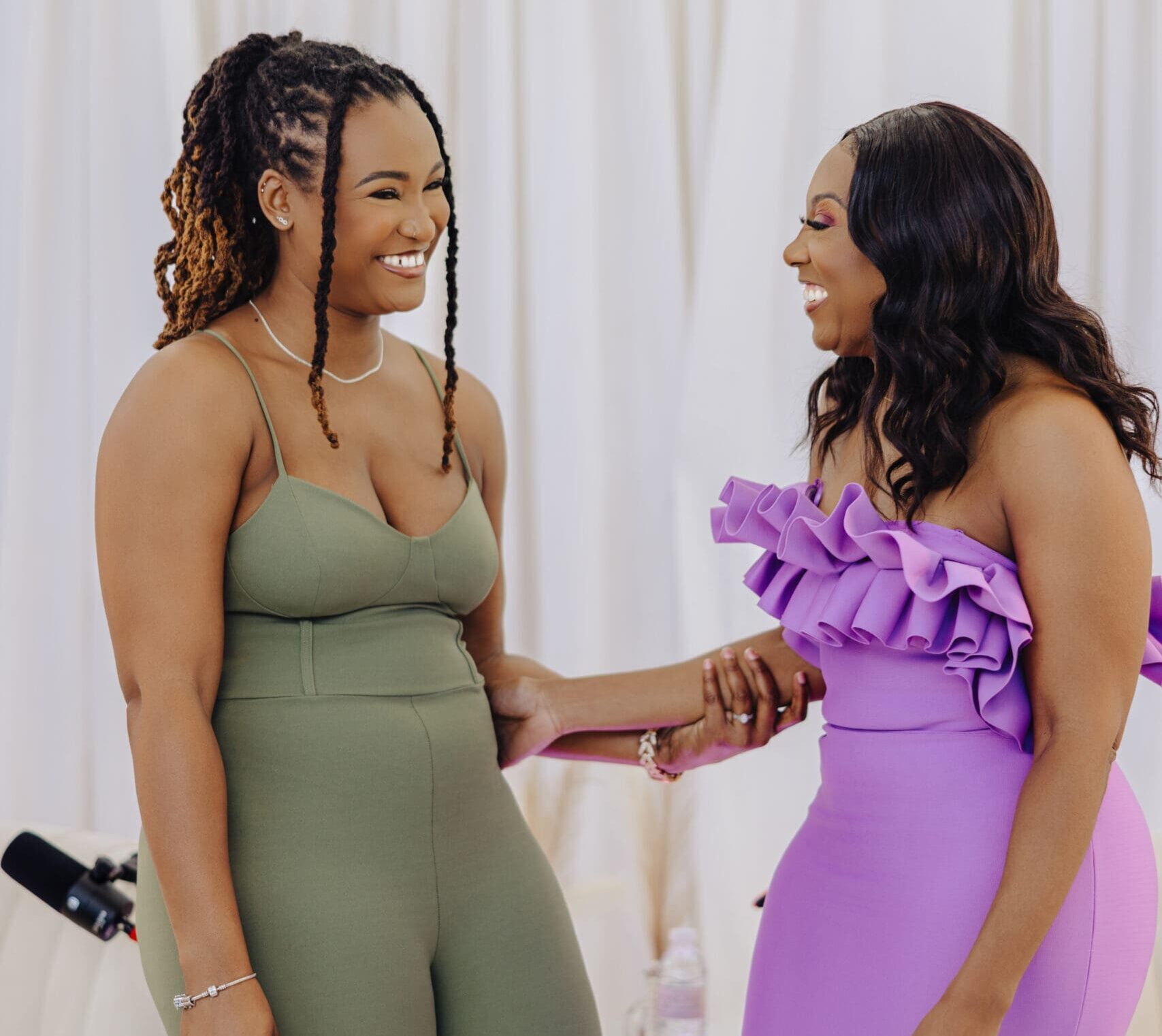 Dr Charmaine Thomas with physiotherapist Natalia Fennell smiling together during the Menopause Rebirth Podcast Episode 2 on tension, tightness, and menopause.