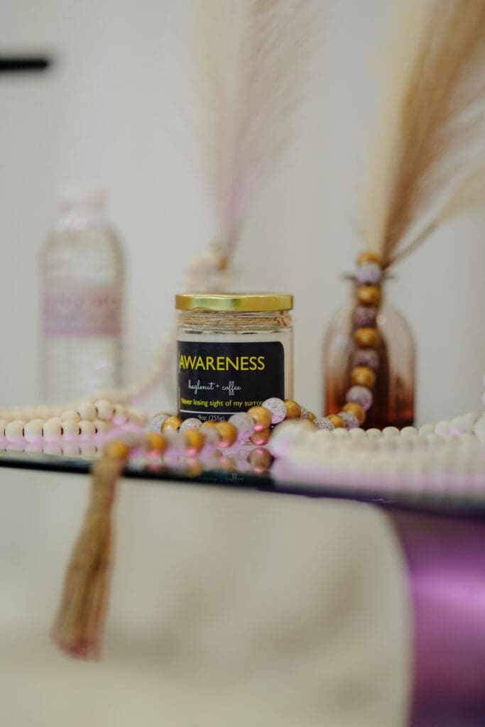 Awareness candle by Wicks by Grey, featured in Episode 4 of the Menopause Rebirth Podcast.
